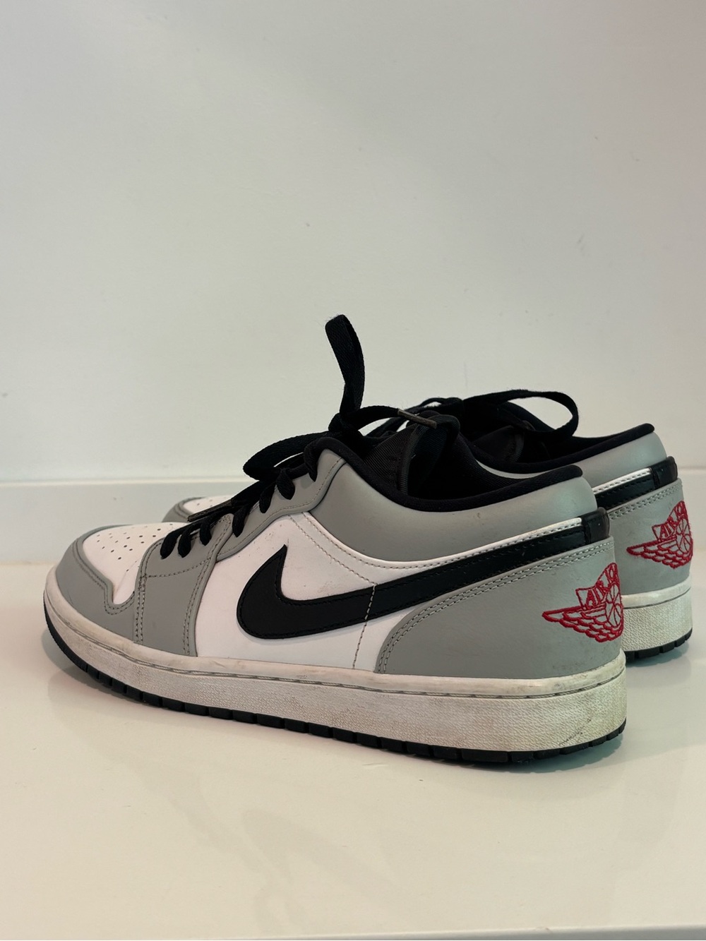 Jordan Low-Top Athletic Sneakers in White, Gray & Black with Red Heel Logo